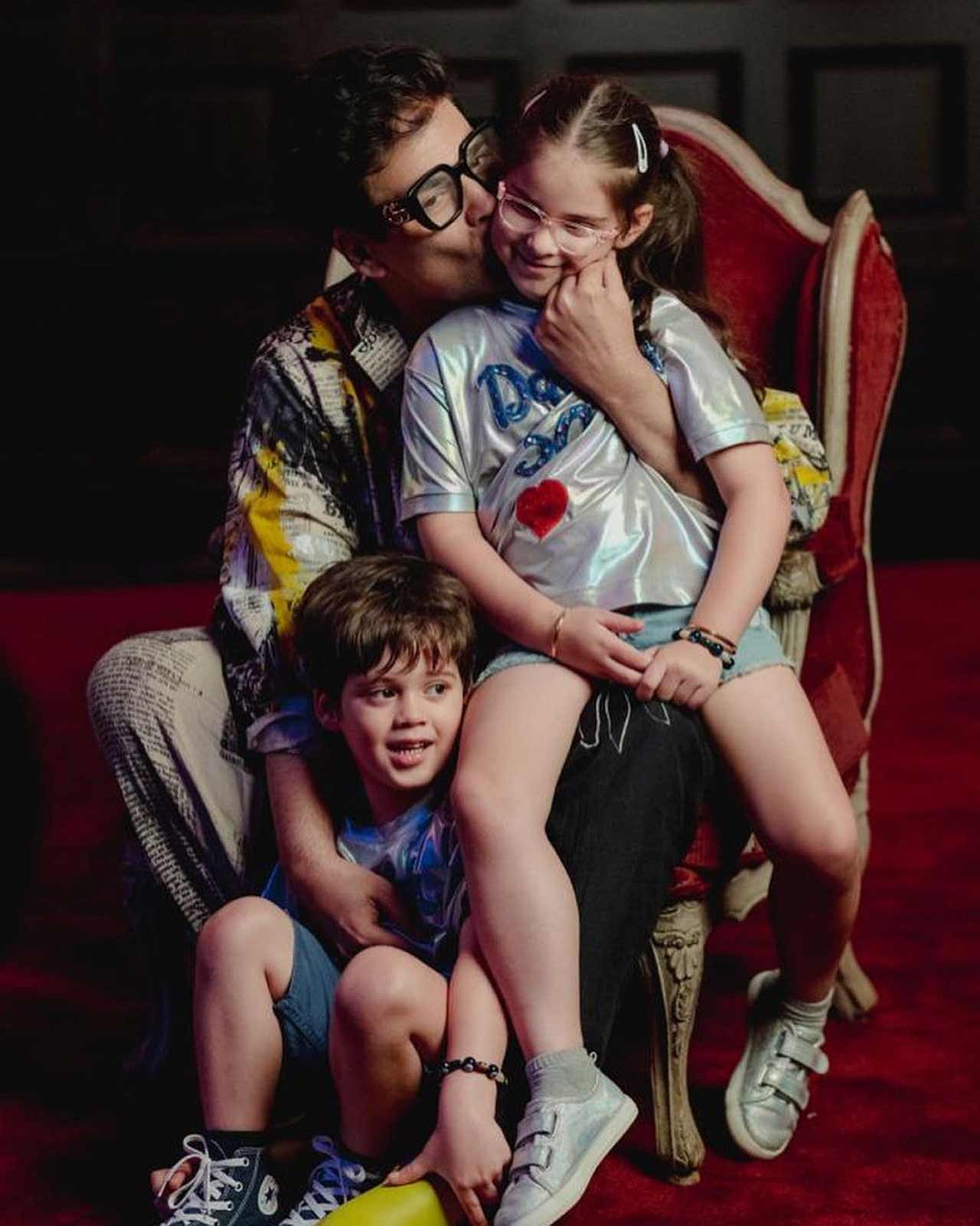Taking to his Instagram handle on Sunday, Karan Johar posted pictures where he can be seen enjoying his twins' company. Yash and Roohi were seen in customized silver tees with 'Dadda 50' written on them.