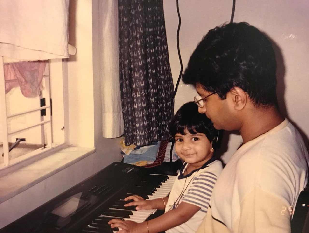 In one of the pictures, Tamaara sat on KK's lap as she kept her fingers on a keyboard