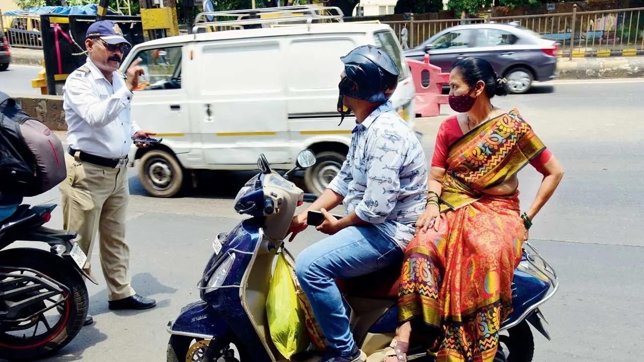 Mumbai: Dadar, Powai among other areas that saw maximum cases of pillion riders without helmets, 23,332 bikers fined