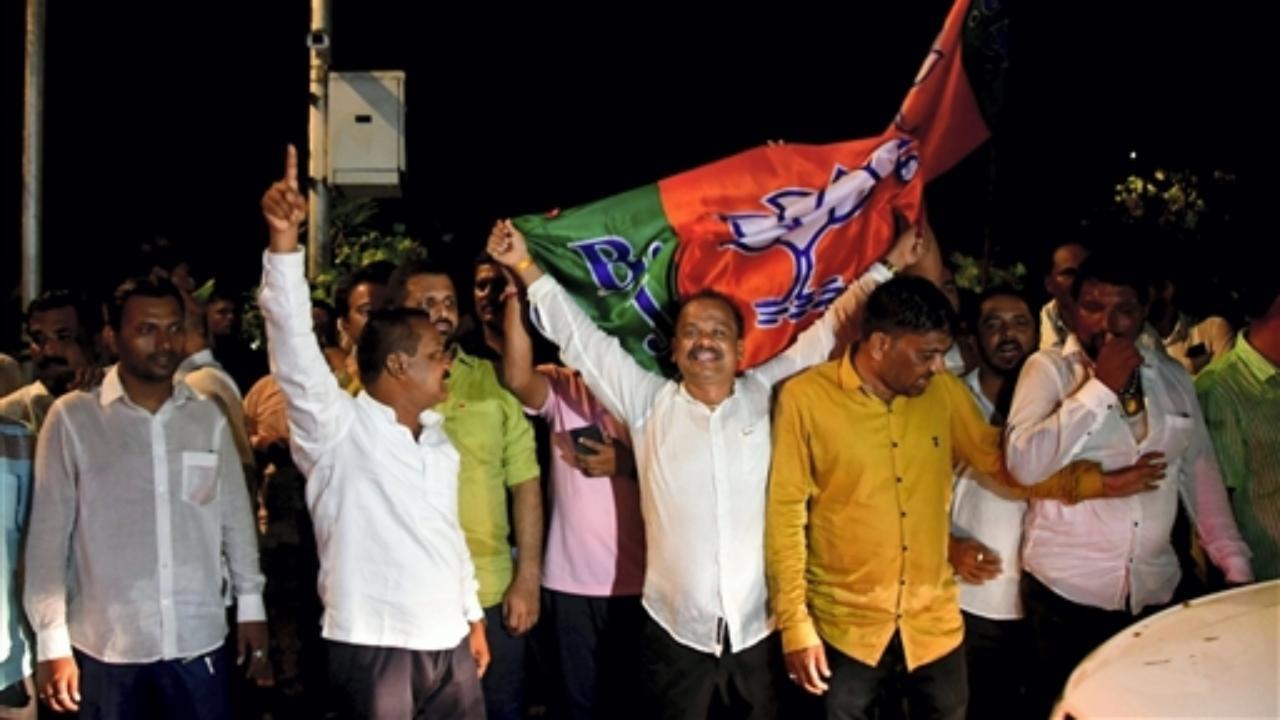 BJP leaders along with activists celebrate after the party won three Rajya Sabha seats from Maharashtra, in Mumbai. Pic/PTI