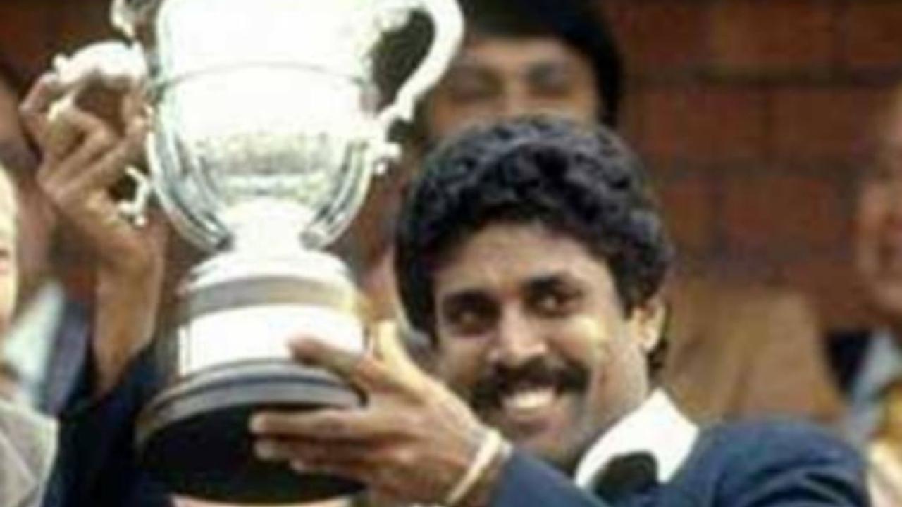 Kapil Dev lifts the Prudential World Cup Trophy after India's victory over the West Indies in the World Cup Final at Lord's cricket ground in London on June 25, 1983