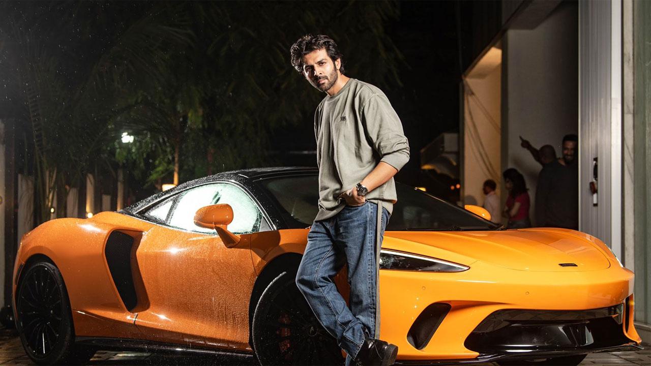 Post the success of 'Bhool Bhulaiyaa 2', which is still minting the moolah at the box-office, the producer of that film Bhushan Kumar has gifted a swanky McLaren to Kartik Aaryan. The duo even struck a pose with the beauty on wheels. Read the full story here