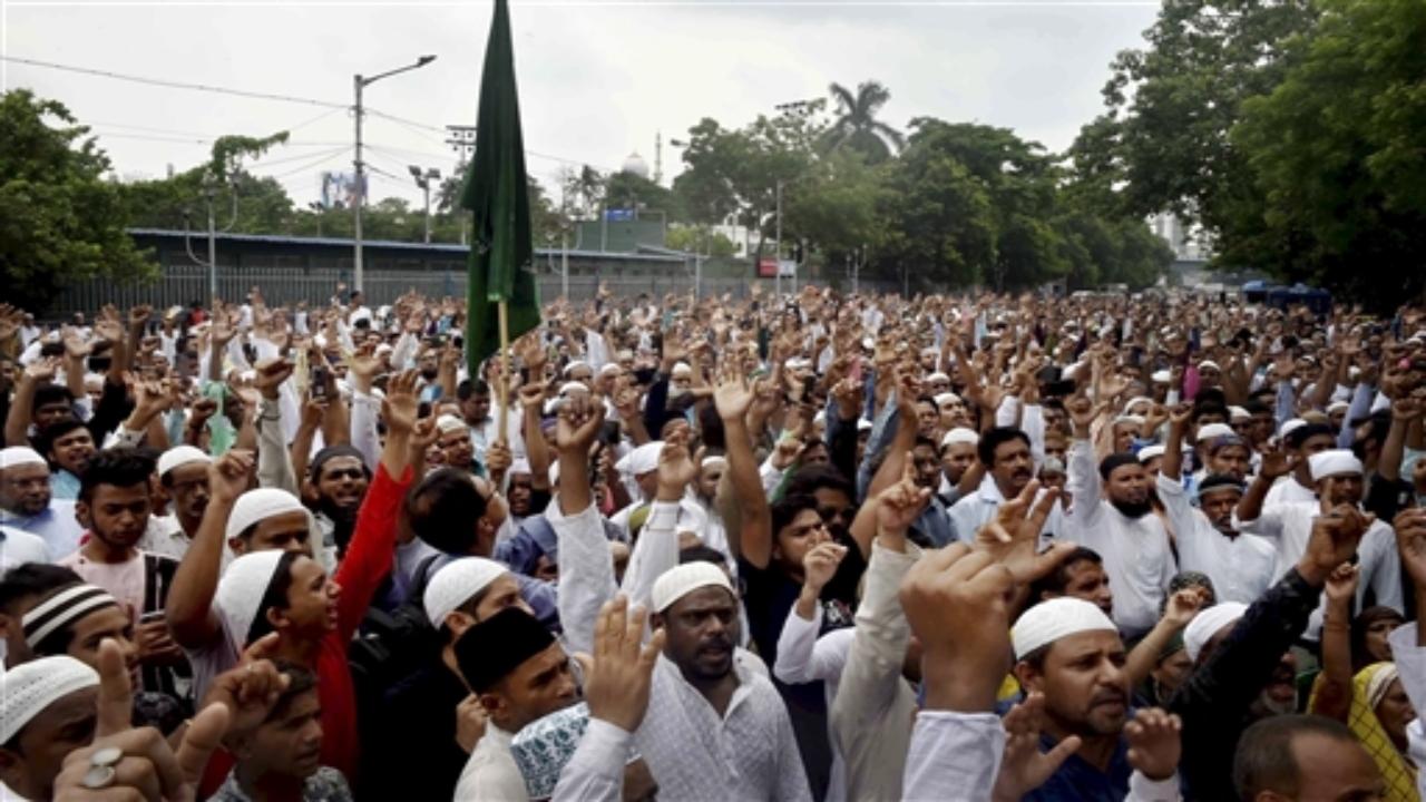 People belonging to Muslim community stage a protest near Park Circus in Kolkata. Pic/PTI