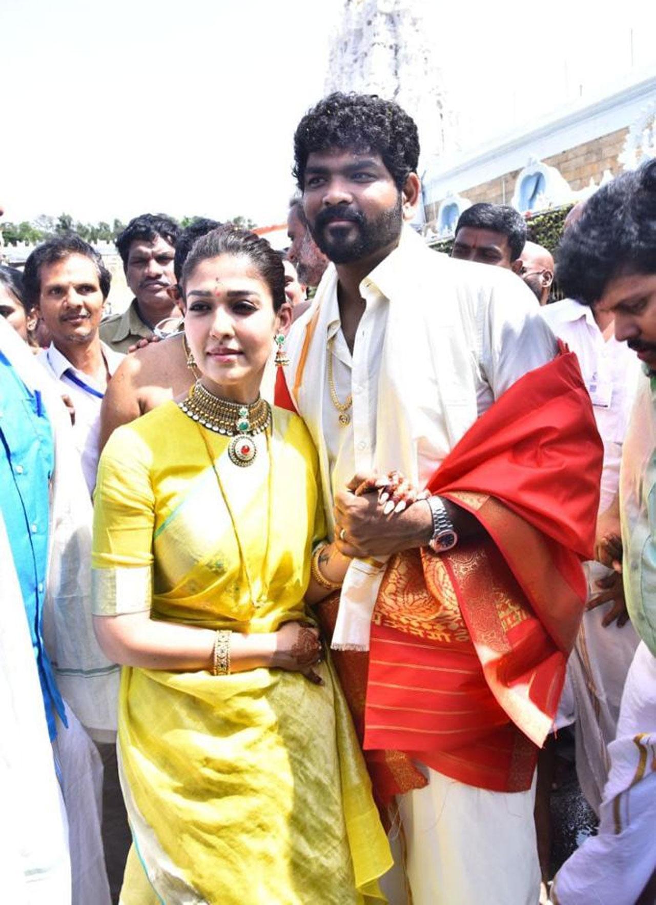 Nayanthara was seen in a stunning yellow sari whereas Vignesh Shivan was clicked in a white shirt and dhoti. Vignesh Shivan wed the love of his life, actress Nayanthara on Thursday in the presence of close family members and a host of friends from the film industry. The guests included stars like Rajinikanth and Shah Rukh Khan
