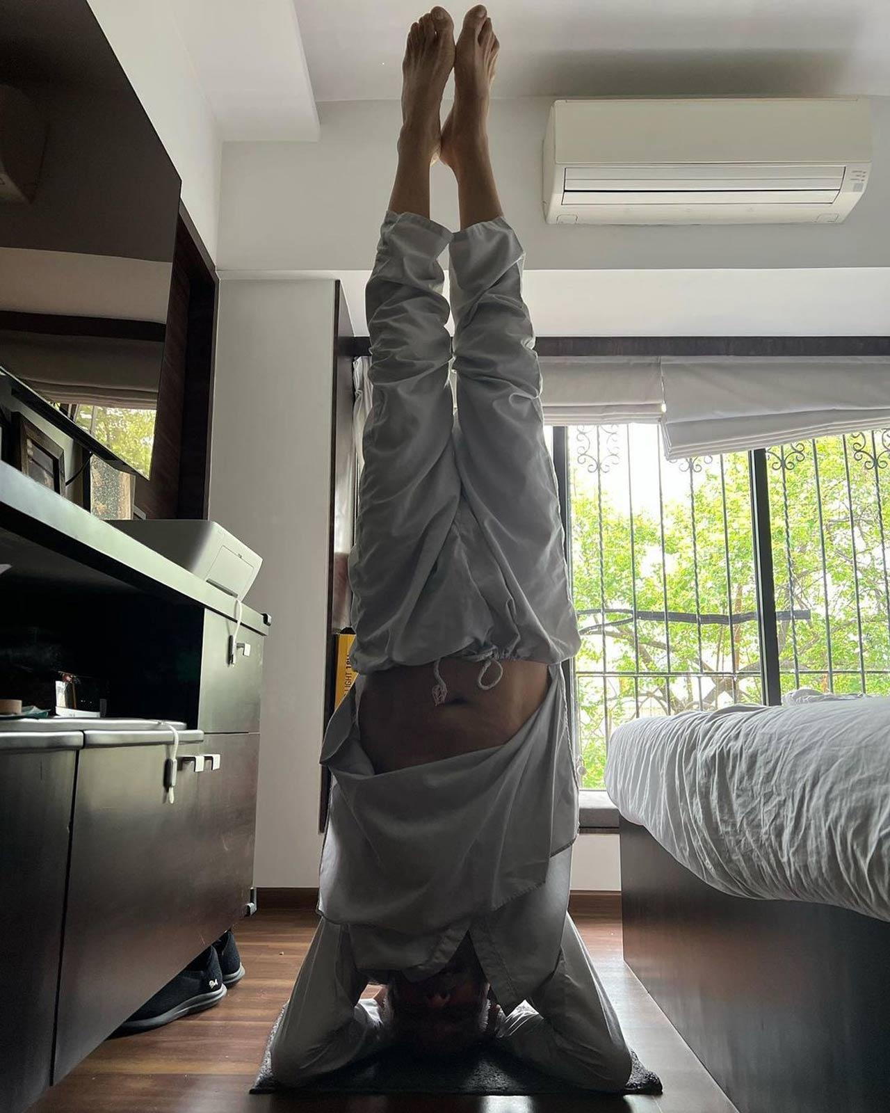 Neha Dhupia effortlessly balances herself as she attempts a head-stand and writes- 