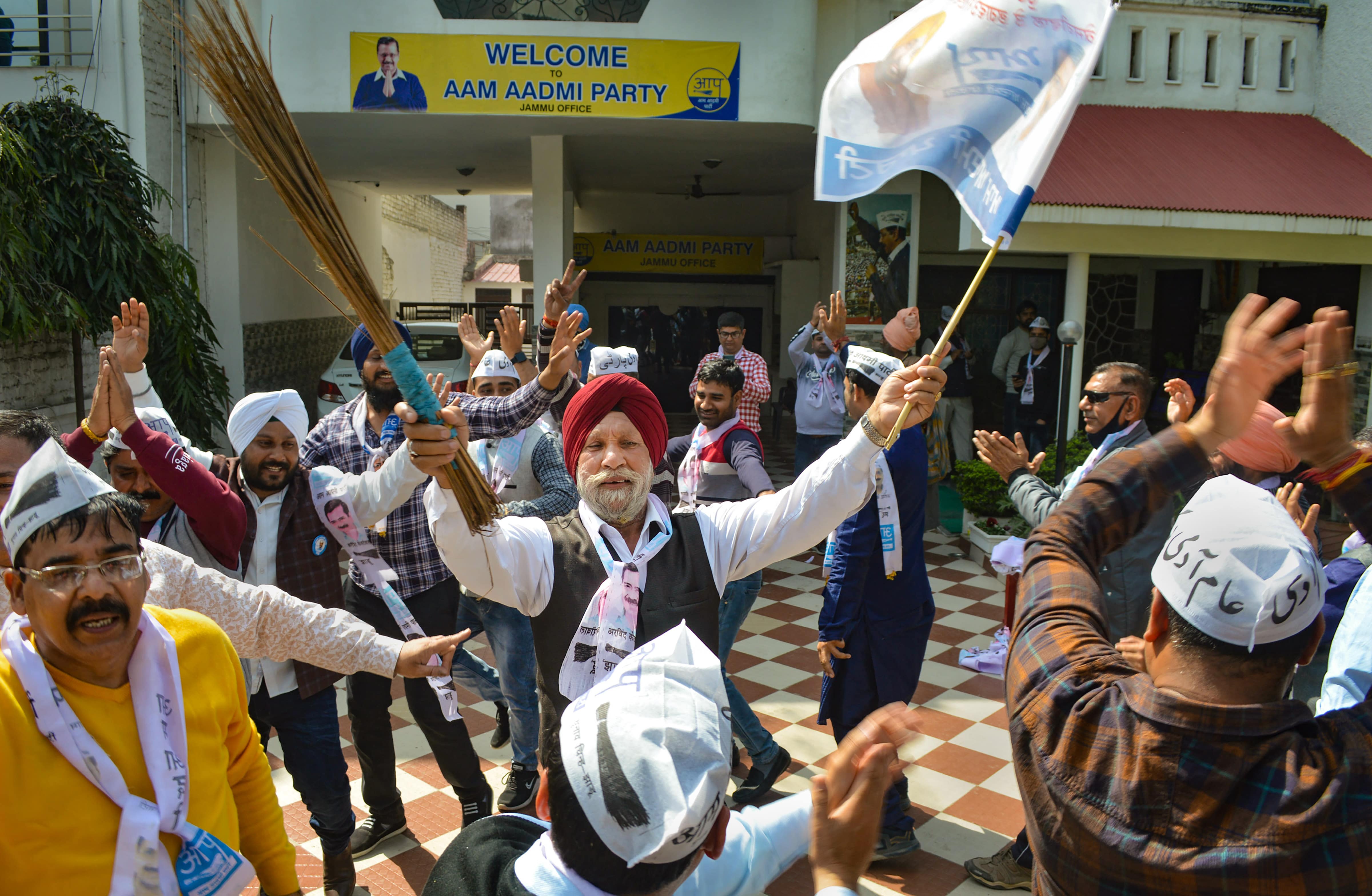 Aam Aadmi Party (AAP) supporters celebrate the party's win in the Punjab Assembly elections