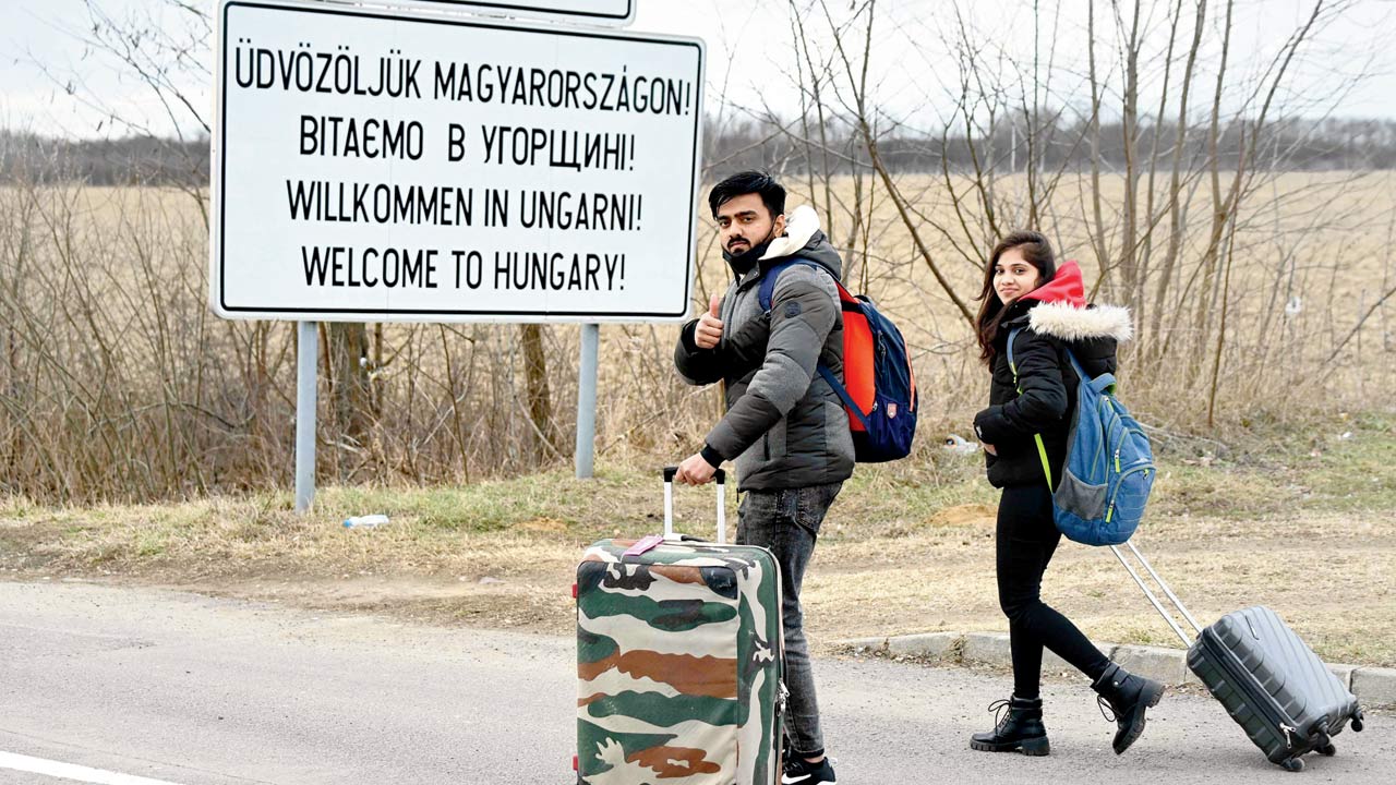 Indian students, who fled from Kyiv, enter Hungary, on Monday. Pic/AFP