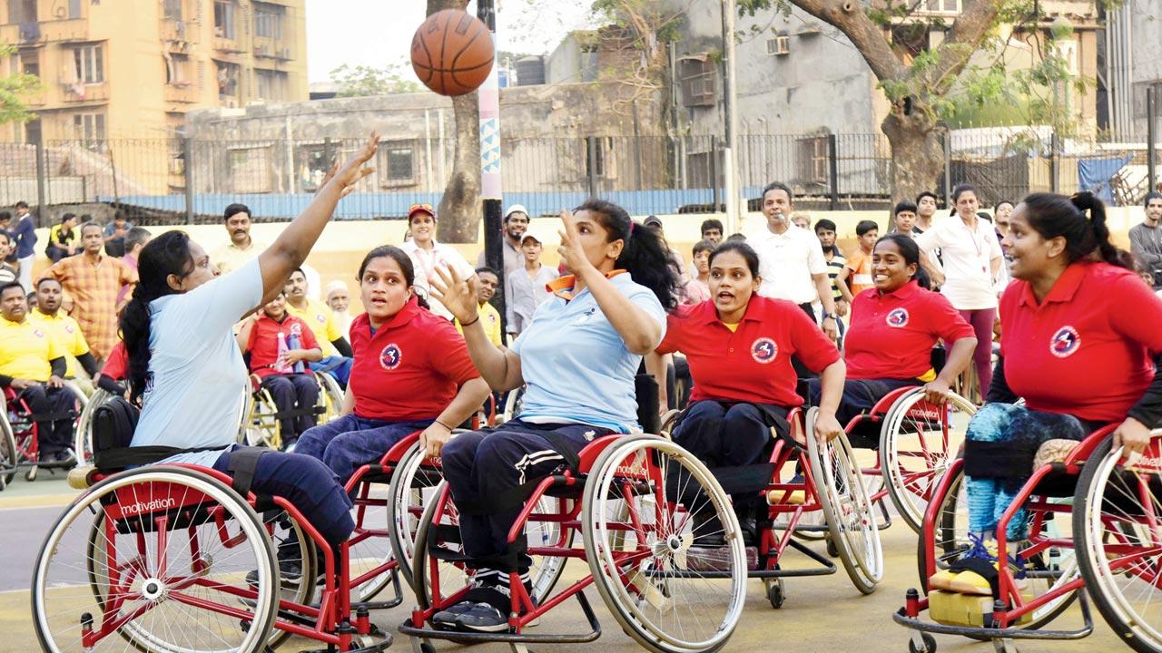 Pune Riders (in red) and Project Mumbai Wheelers (in blue) battle it out at Project Mumbai’s Wheelchair Basketball Premier League at Mastan Talao basketball court. Pic/Suresh Karkera
