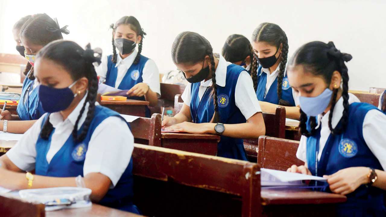 Students of Saraswati Mandir High School, Mahim, write exam