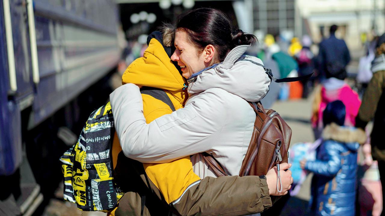 A mother embraces her son who escaped the besieged city of Mariupol and arrived at Lviv, Ukraine. Pic Courtesy/AP, PTI