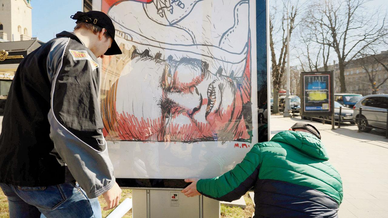 Workers set anti-Russian placards by printing house Zovnishnya Reklama (Outdoor advertising) in Lviv on Monday. Pic/AFP