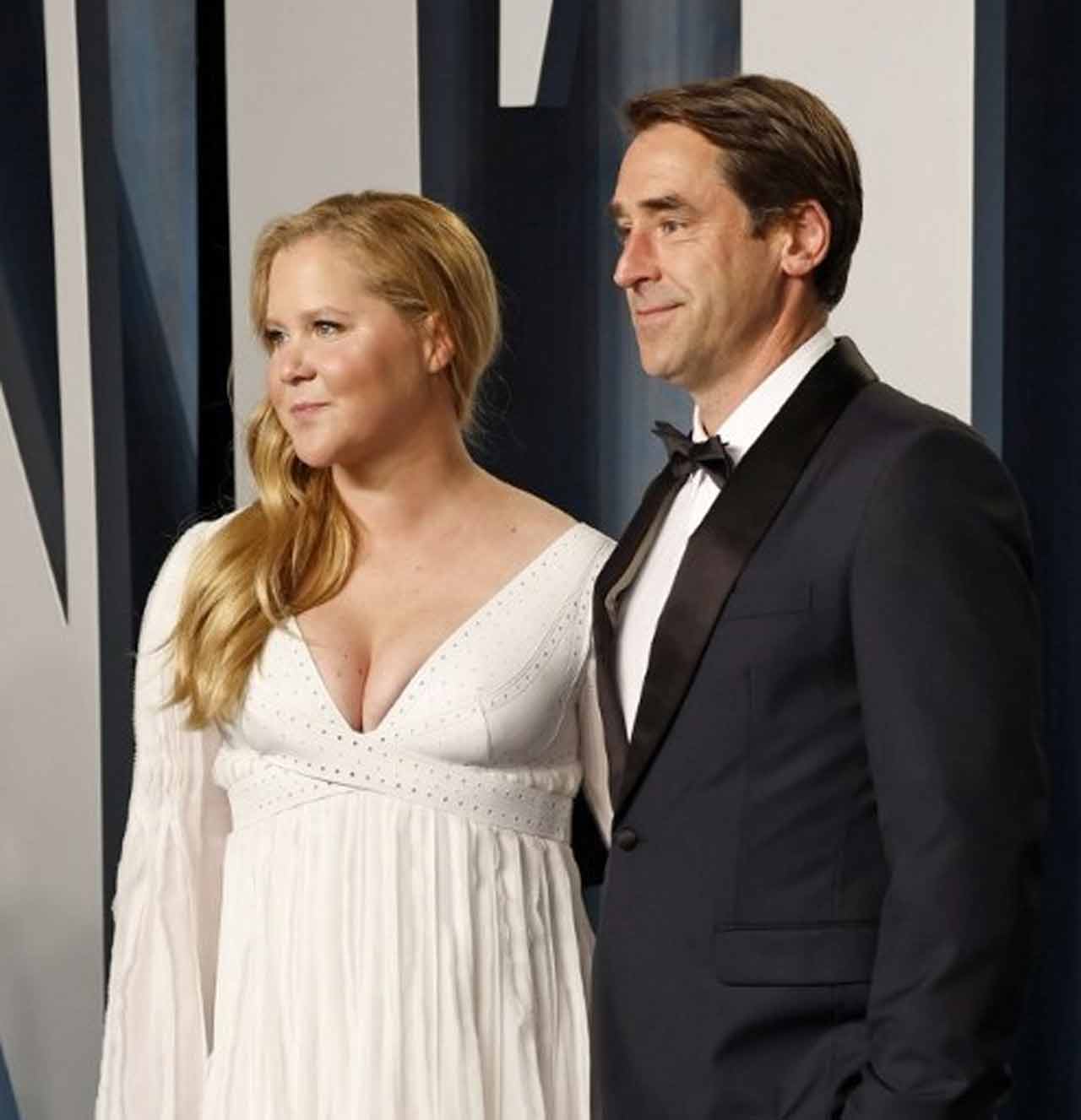 Amy Schumer and Chris Fischer were clicked together at the Oscars after-party. Schumer, who was one of the hosts at the 94th Academy Awards, took aim at Hollywood star Leonardo DiCaprio during the opening monologue at the Oscars held at the Dolby Theatre in Los Angeles. Schumer, Wanda Sykes and Regina Hall were hosting this year's ceremony, starting it with a speech in which they made jokes aimed at 'The Power of the Dog', actors J.K. Simmons and Samuel L Jackson, reported independent.co.uk.