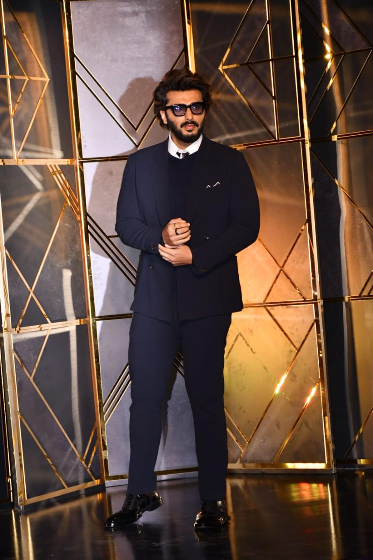 Arjun Kapoor showed off his uber side in a suit as he attended Apoorva Mehta's 50th birthday celebration.