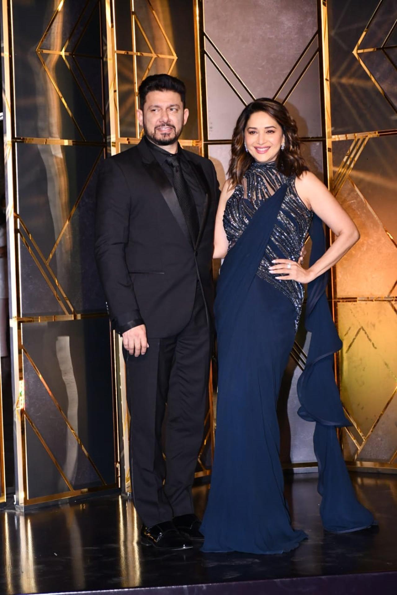 Madhuri Dixit attended the party with her husband Sriram Nene. Tho due showed off their ethereal side as they posed for the shutterbugs together.