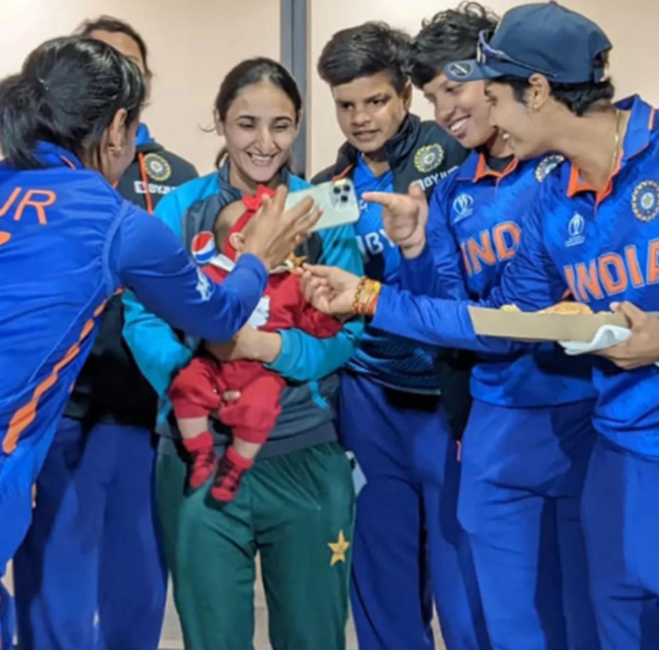 The Indian women's cricket team along with Pakistan women's cricket captain Bismah Maroof and her baby. The Indian women's team defeated the Pakistan women's team in their ICC Women's World Cup opener by a huge margin of 107 runs thanks to Smriti Mandhana and Deepti Sharma's vital partnership and Rajeshwari Gayakwad's four-wicket haul. Post the match, both team's displayed the true spirit of cricket with the Indian women's team giving Maroof and her newborn baby a warm welcome. Picture Courtesy/ ICC's official Instagram