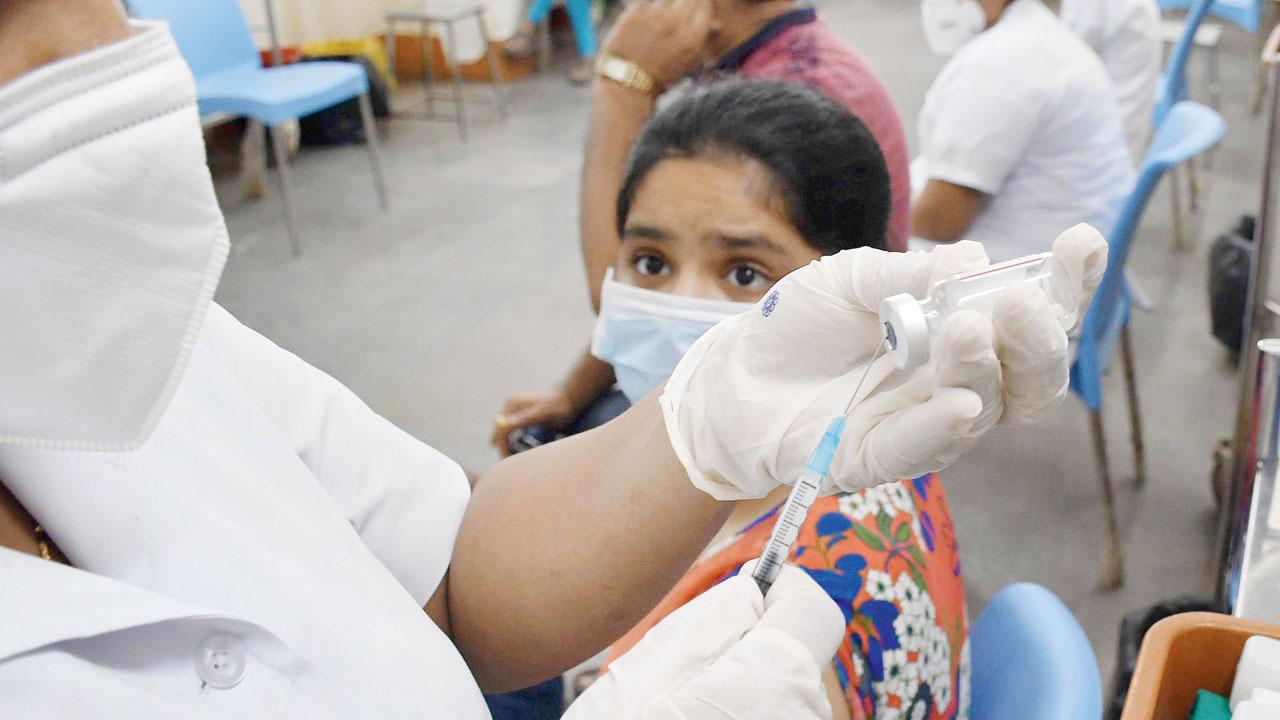 A nurse prepares to administer a dose of Corbevax to a girl at Nair hospital on Thursday. Pic/Ashish Raje