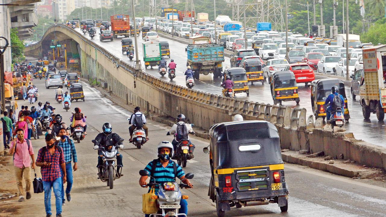 Bikers ride on the wrong side of the WEH at Kandivli on July 7, 2021. Pic/Satej Shinde