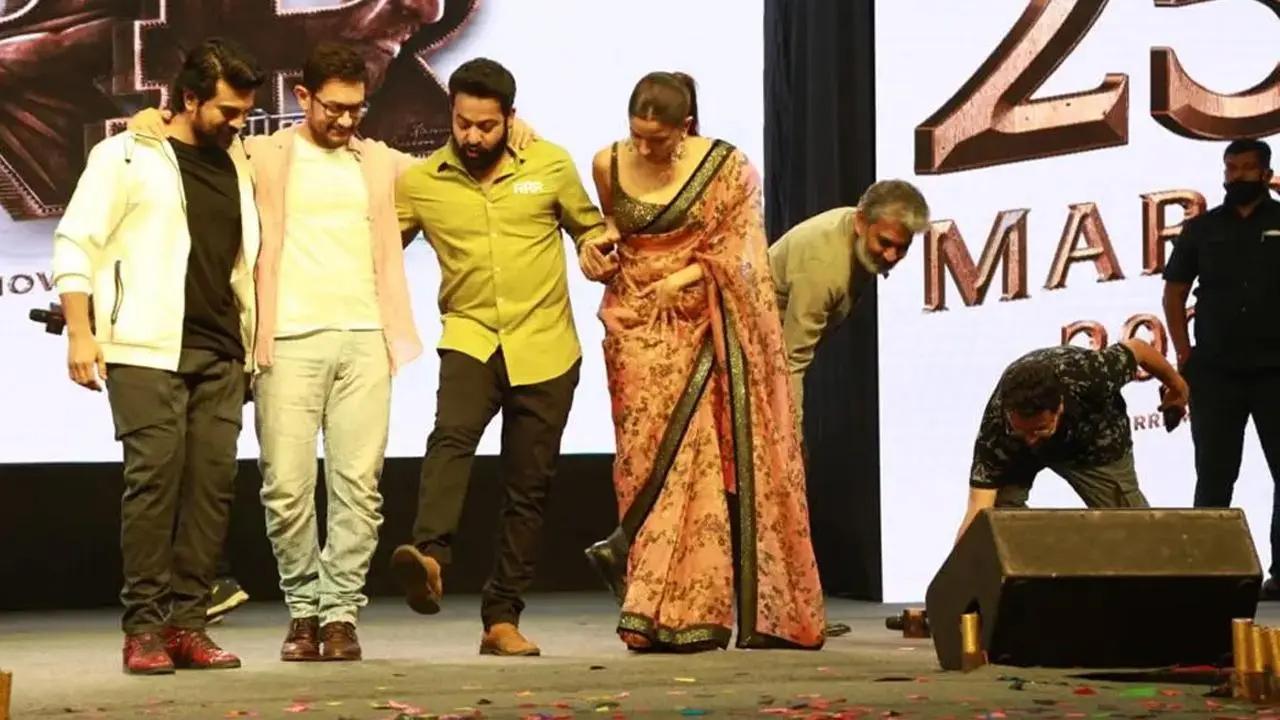 Aamir Khan learns how to dance to 'Naatu Naatu' from Jr NTR, Ram Charan
Bollywood superstar Aamir Khan was seen shaking-a-leg with stars NTR Jr and Ram Charan during a fab event for their upcoming film 'RRR'. The cast of 'RRR' including Alia Bhatt and filmmaker S.S. Rajamouli were in the national capital to promote the film. Aamir joined the cast during the fan event. Read the full story here.