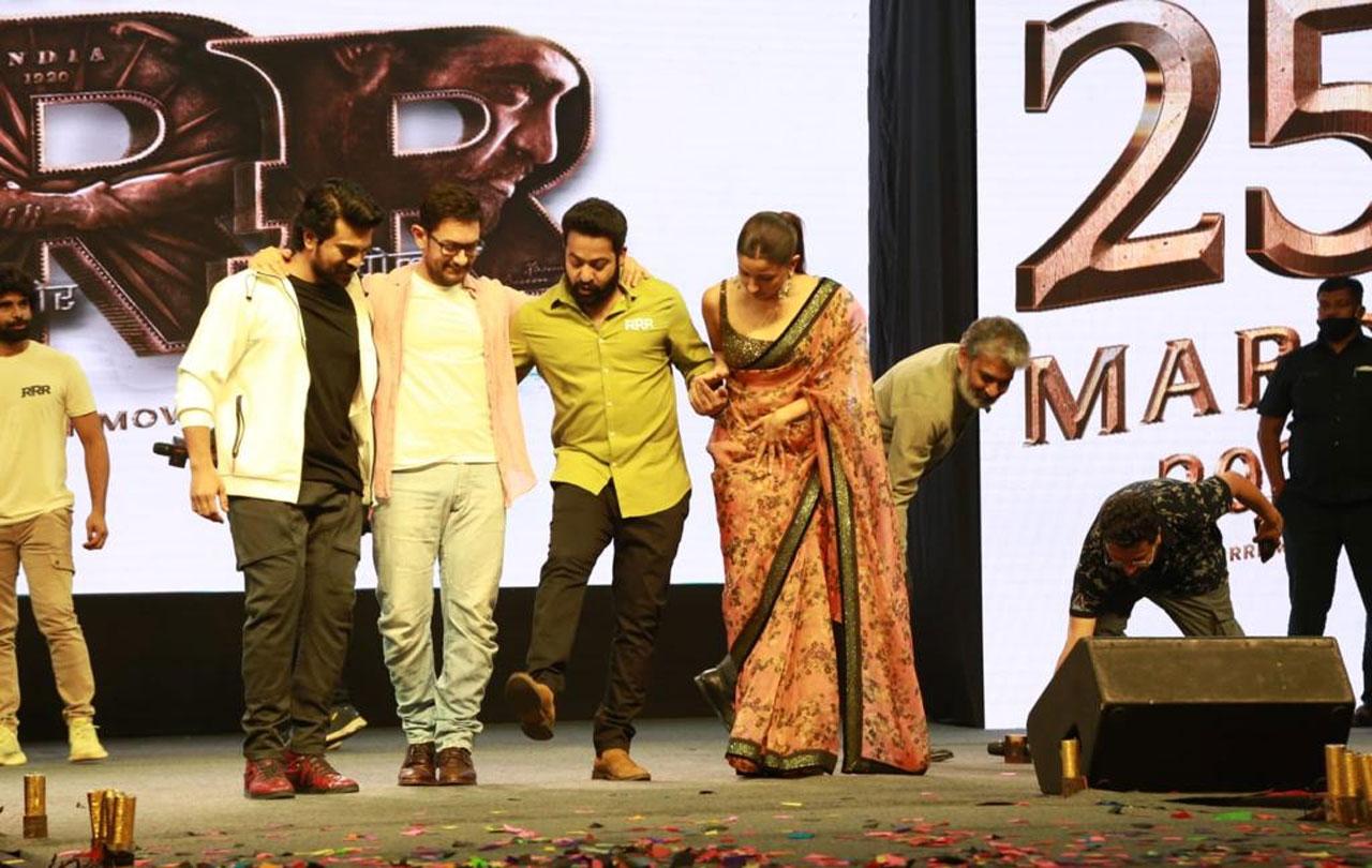 Aamir Khan was seen shaking-a-leg with stars NTR Jr and Ram Charan during a fab event for their upcoming film 'RRR'. Aamir was seen asking the the two actors on how they did the step, which the 'PK' star felt could not perform.