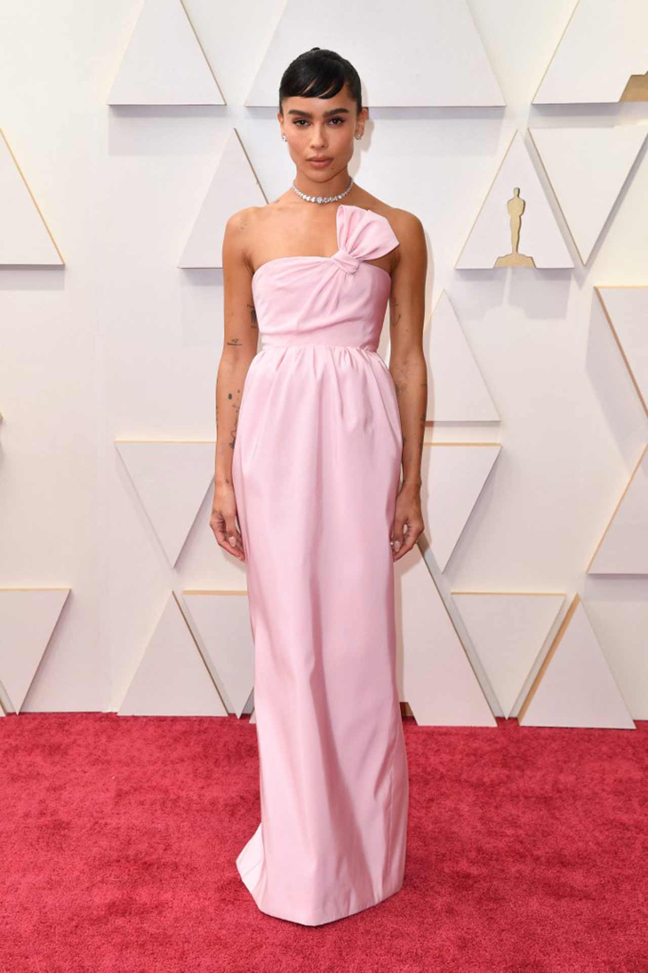 Zoe Kravitz, The 'Batman' star kept things simple and beautiful with a pastel pink floor-length Saint Laurent dress. Complimenting her minimal look, she added a sparkling choker and stud earrings.
