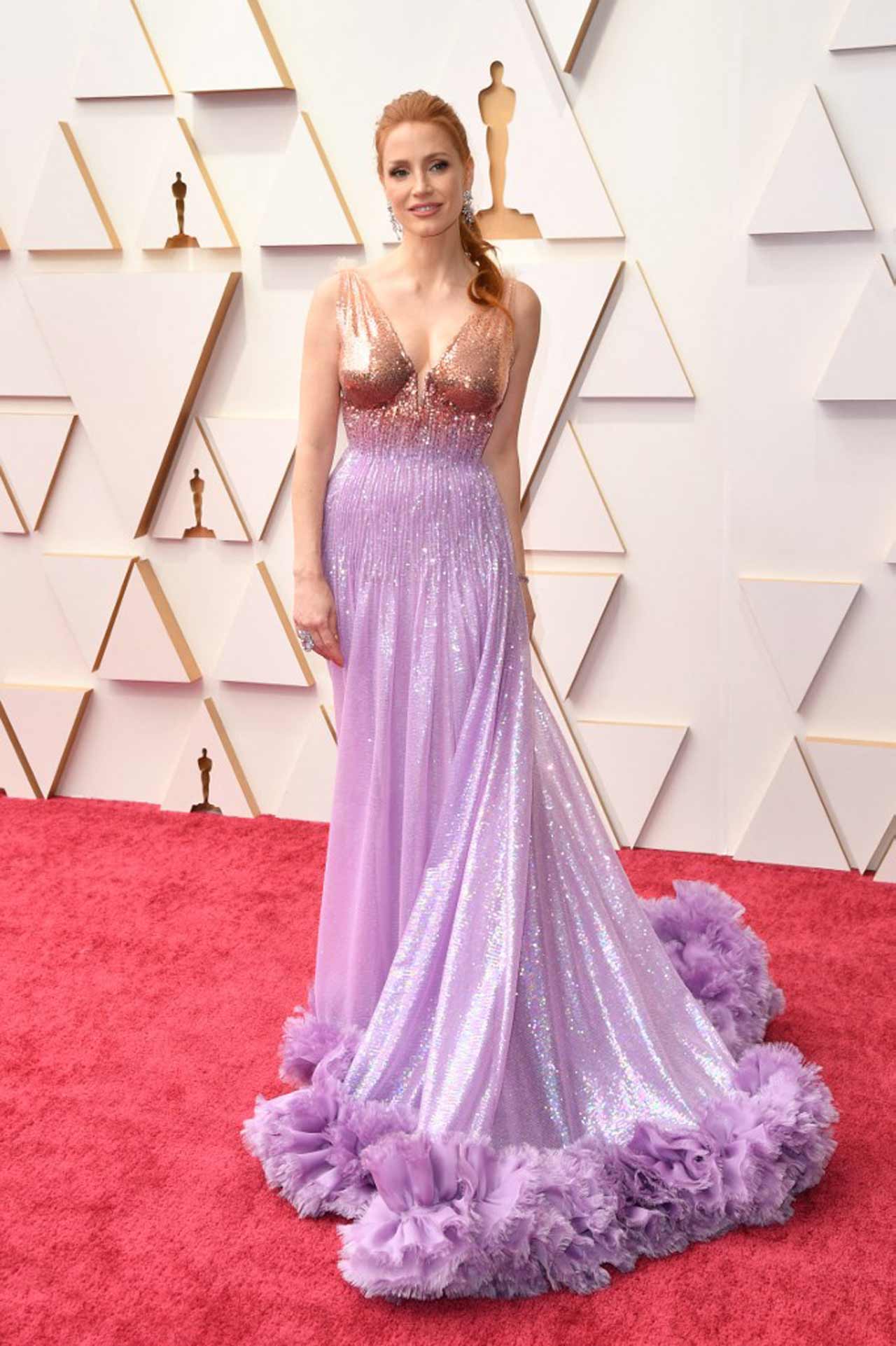 Jessica Chastain, who was nominated for an Oscar for 'The Eyes of Tammy Faye', was a pastel dream in an ombre Gucci gown with rose gold bodice fading into a fully sequin lavender skirt with tulle hem, plus major chandelier earrings.