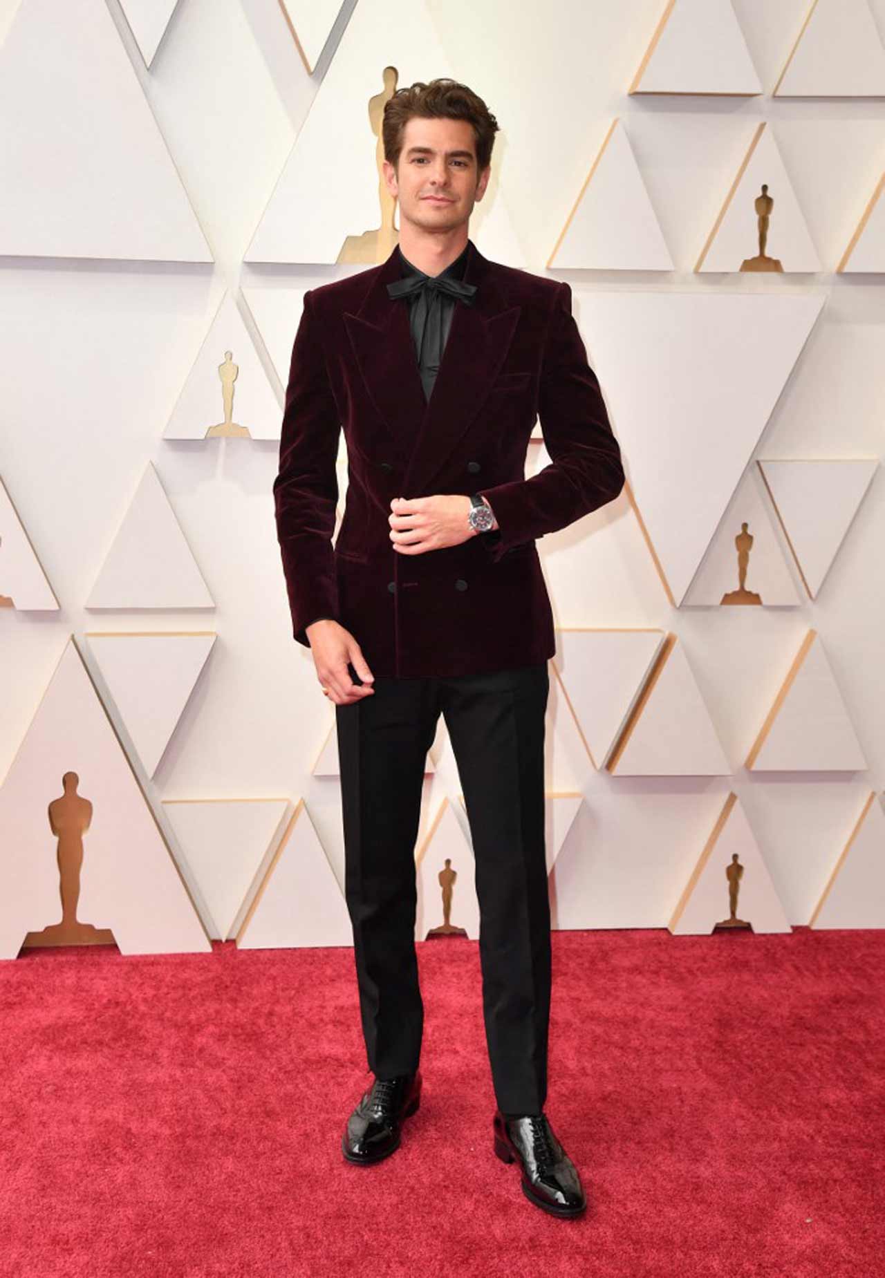 Andrew Garfield sported an eggplant velvet jacket, floppy bow tie and black pants with a David Yurman ring.