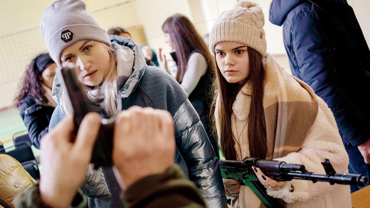Lviv: Ukrainian civilians receive weapons training, in the outskirts of Lviv on Monday. Pics/AP