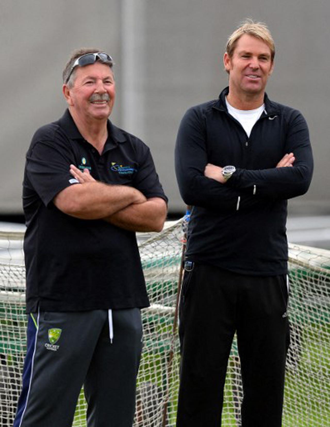 A file photo taken on July 31, 2013 shows Rod Marsh (L) laughing with Shane Warne as they watch a practice session ahead of the third Ashes Test between England and Australia at Old Trafford in Manchester. Former Australian cricketing great Marsh died earlier today after suffering a heart attack last week.