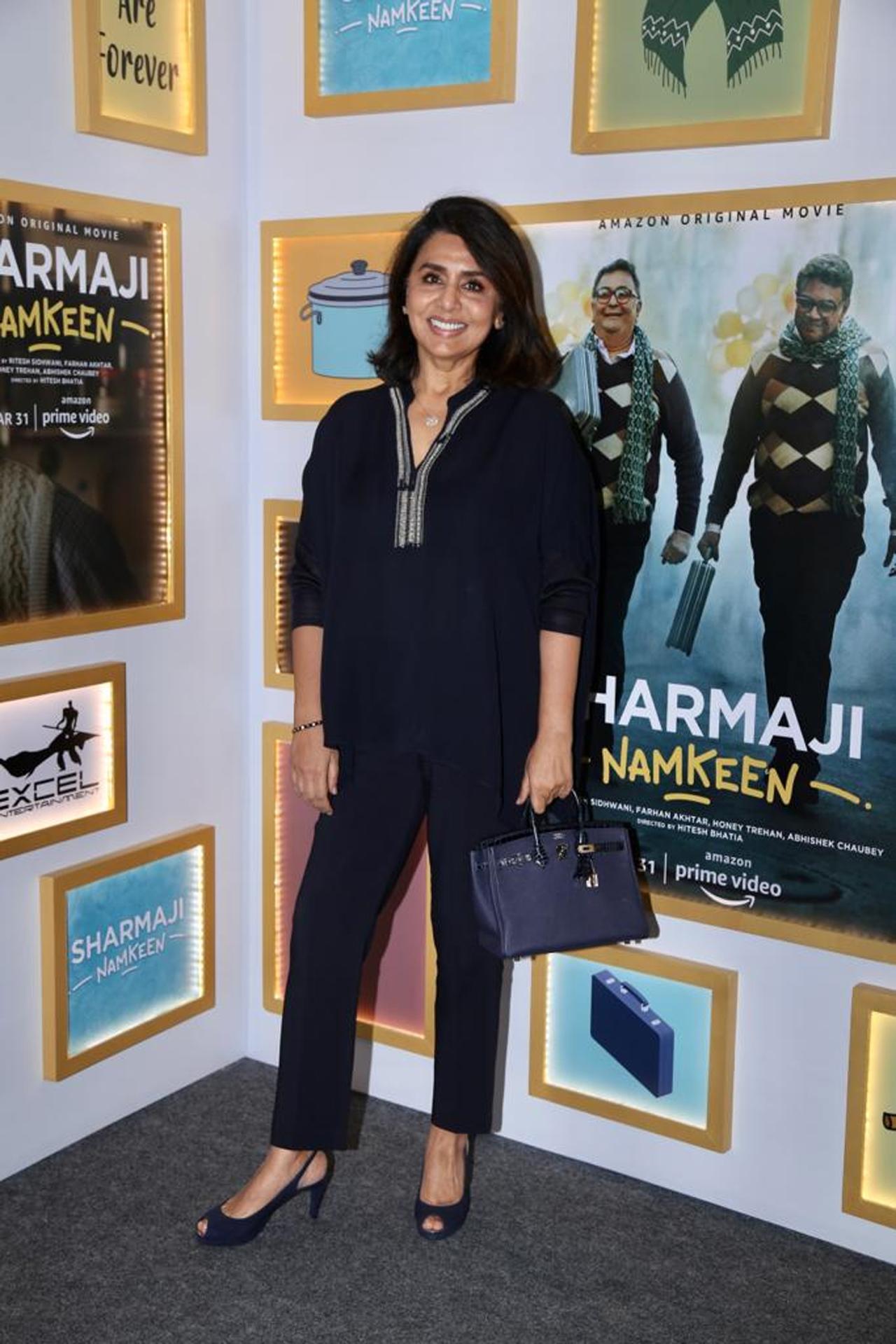 Neetu Kapoor was seen wearing a black kurta with black pants whereas Ranbir wore a funky shirt on light shaded jeans.