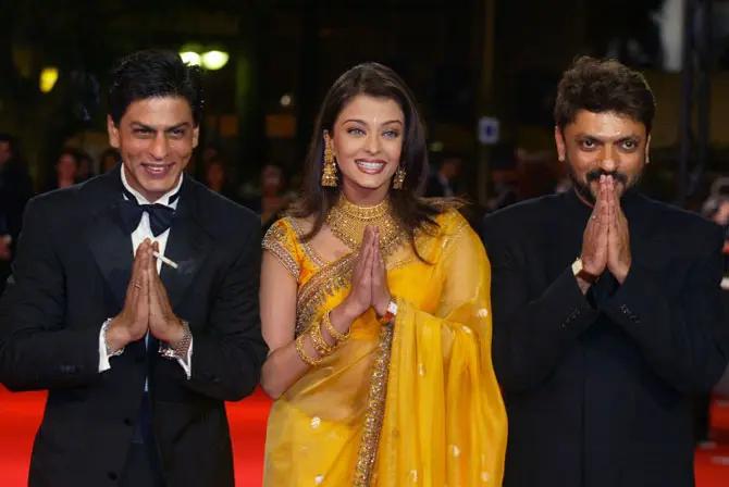 Shah Rukh Khan, Aishwarya Rai and Sanjay Leela Bhansali greet the photographers the desi way with a 'Namaste' at the Palais des Festivals for the screening of their film 'Devdas' during the 55th Cannes film festival on May 23, 2002.