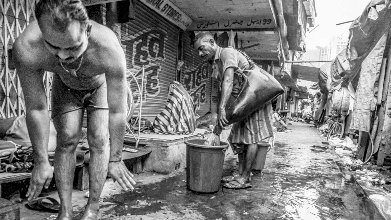 A man from the Bhistee community at work in old Mumbai’s bylanes;  the picture is a part of I Remember Water Worldwide Exhibition.  PIC COURTESY/ASLAM SAIYAD, LIVING WATERS MUSEUM
