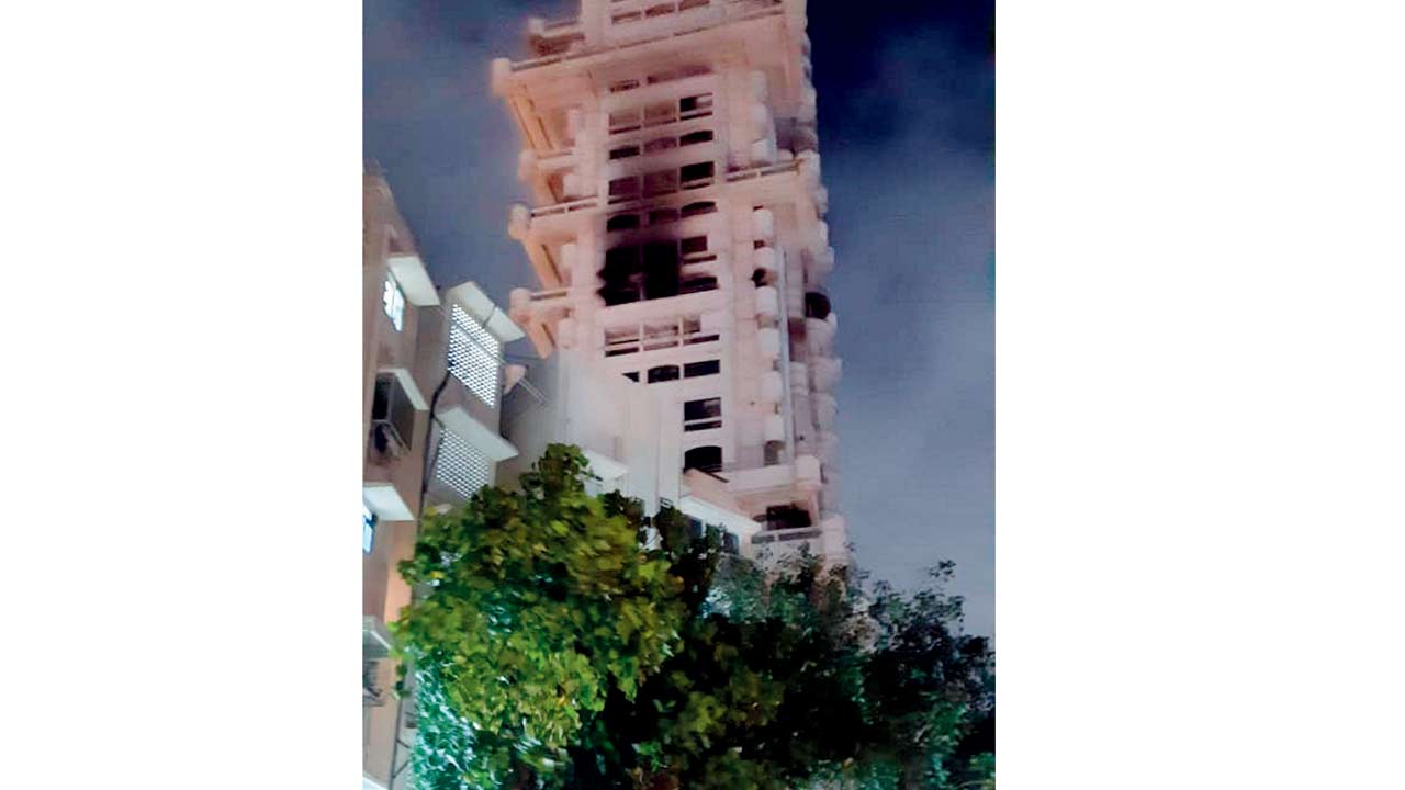 Fire officers evacuated residents trapped on the upper floors of Jivesh building in Bandra after the heat and smoke reduced