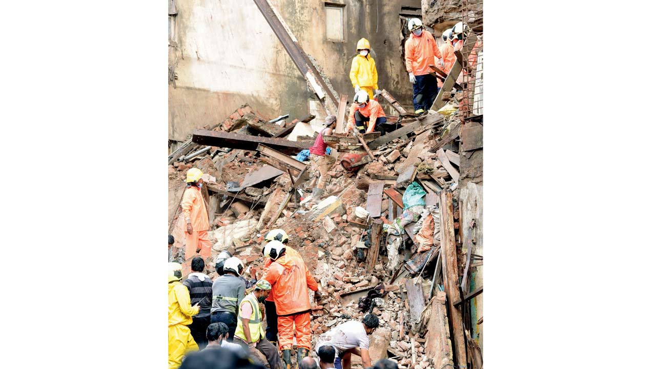Rescuers at a building collapse site, at Fort, on July 16, 2020. Pic/Bipin Kokate