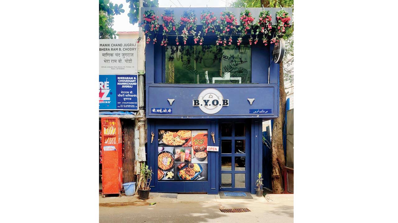 BYOB is a cutesy place from the outside, with berry blue walls and red plastic flowers hanging from above