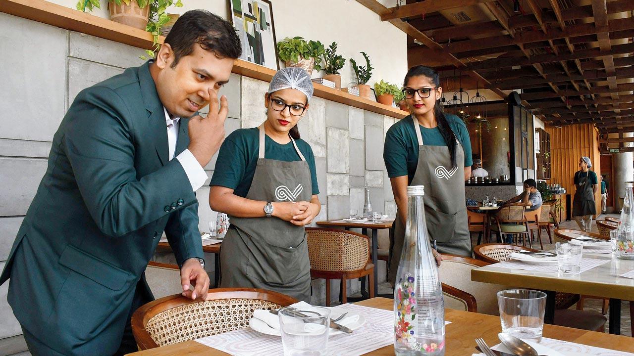 Tarik Hossain, a speech and hearing-impaired person, joined Mirchi and Mime as a steward in 2015. Today, not only has he risen to the rank of assistant restaurant manager, but is also involved in recruitment of other speech and hearing-impaired persons and their training. Here he is teaching his team members how to greet guests, serve water or ensure that  cutlery is spotless. Pic/Ashish Raje