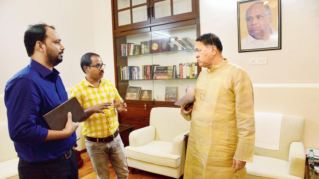 mid-day’s Faizan Khan and Diwakar Sharma explain the newspaper’s investigation to state home minister Dilip Walse Patil. Pic/Pradeep Dhivar