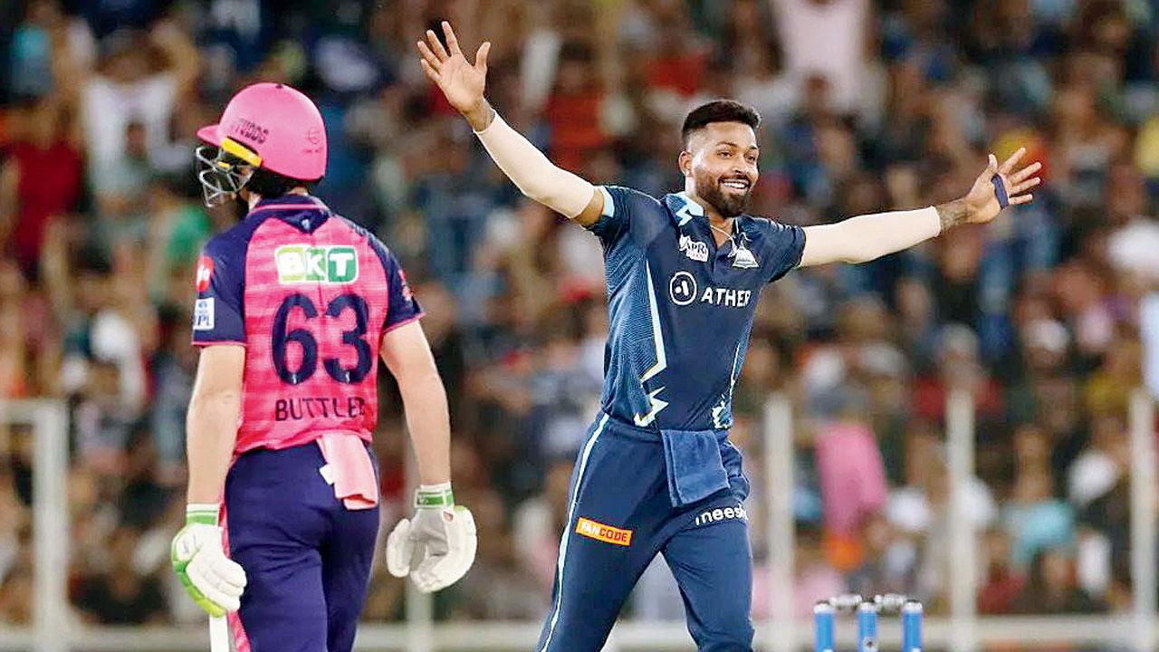 Hardik Pandya (right) is ecstatic after dismissing RR’s Jos Buttler