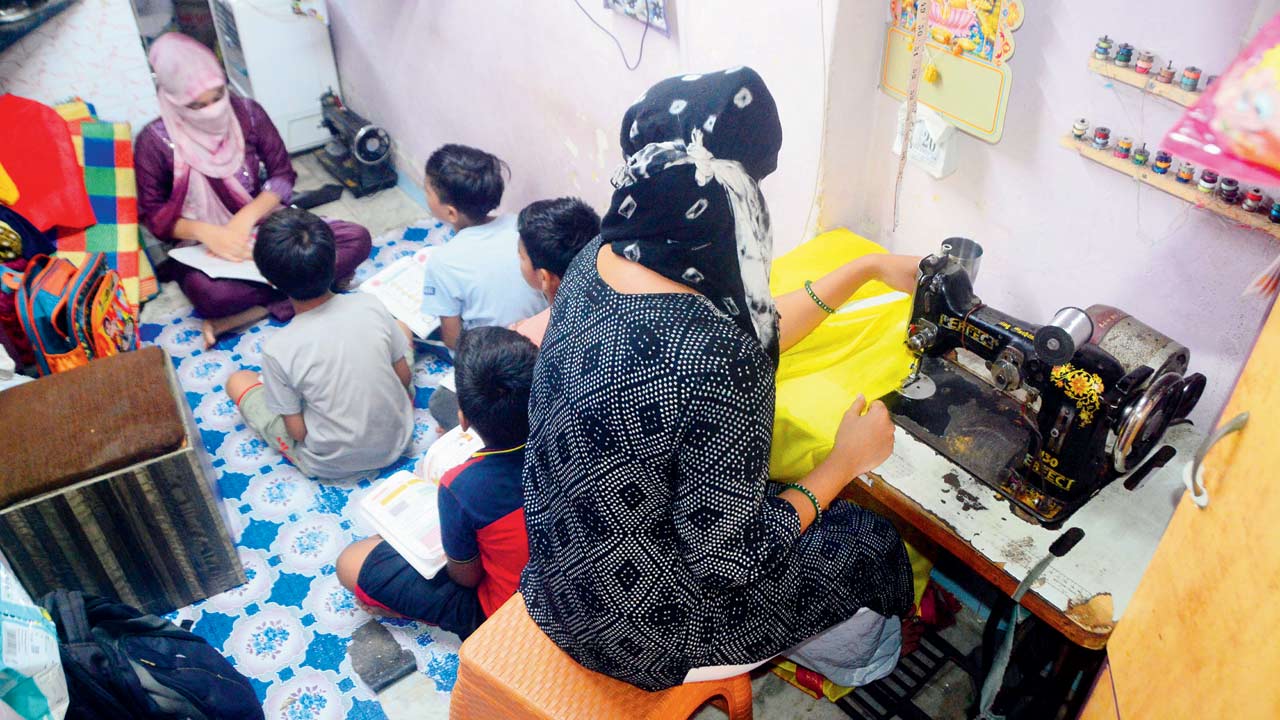 The survivor teaches students while her mother stitches clothes, at their house. Pic/Sameer Markande