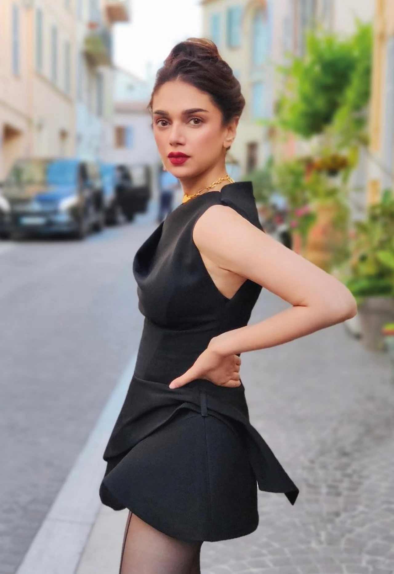 Aditi Rao Hydari looked chic in a little black dress, paired with a high bun and red lipstick.