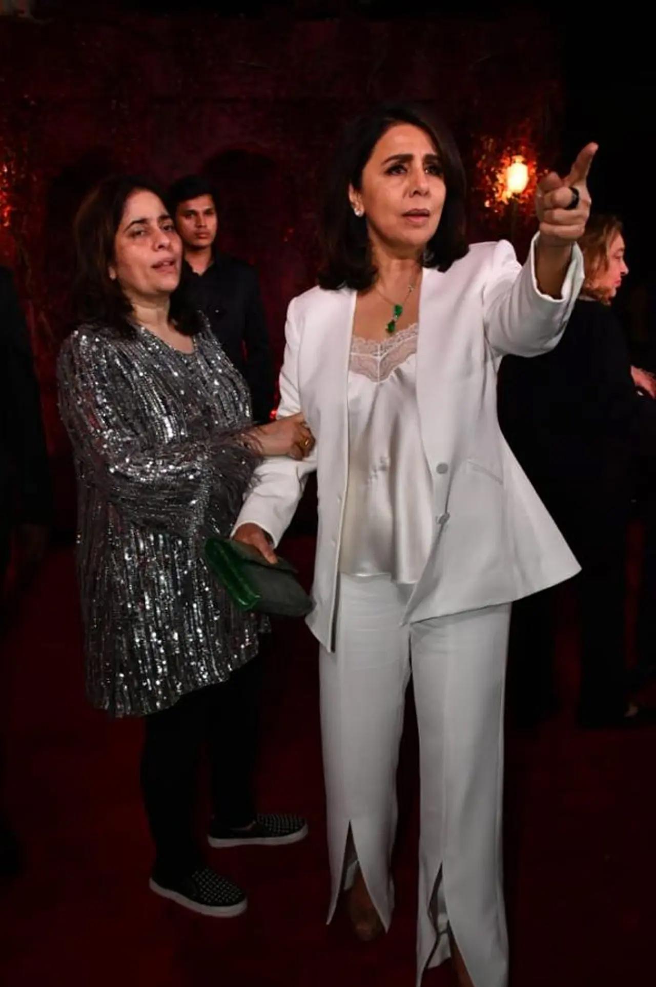 Neetu Kapoor nailed her white suit for the bash but what exactly was happening over here? Any guesses?