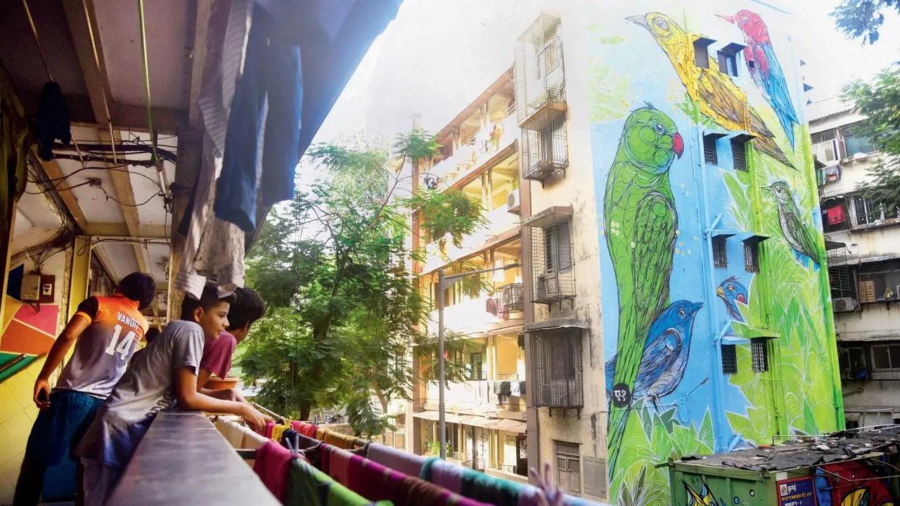 Not just another bird in the wall: Belgian artist Dzia’s mural to celebrate the bilateral ties between India and Belgium looms large at Shahu Nagar in Dharavi. Pic/Shadab Khan