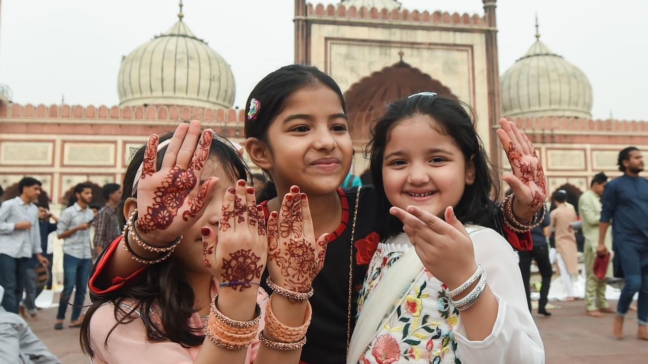 Muslim children after offering prayers at the Jama Masjid on the occasion of Eid-ul-Fitr, in old Delhi. Pic/PTI