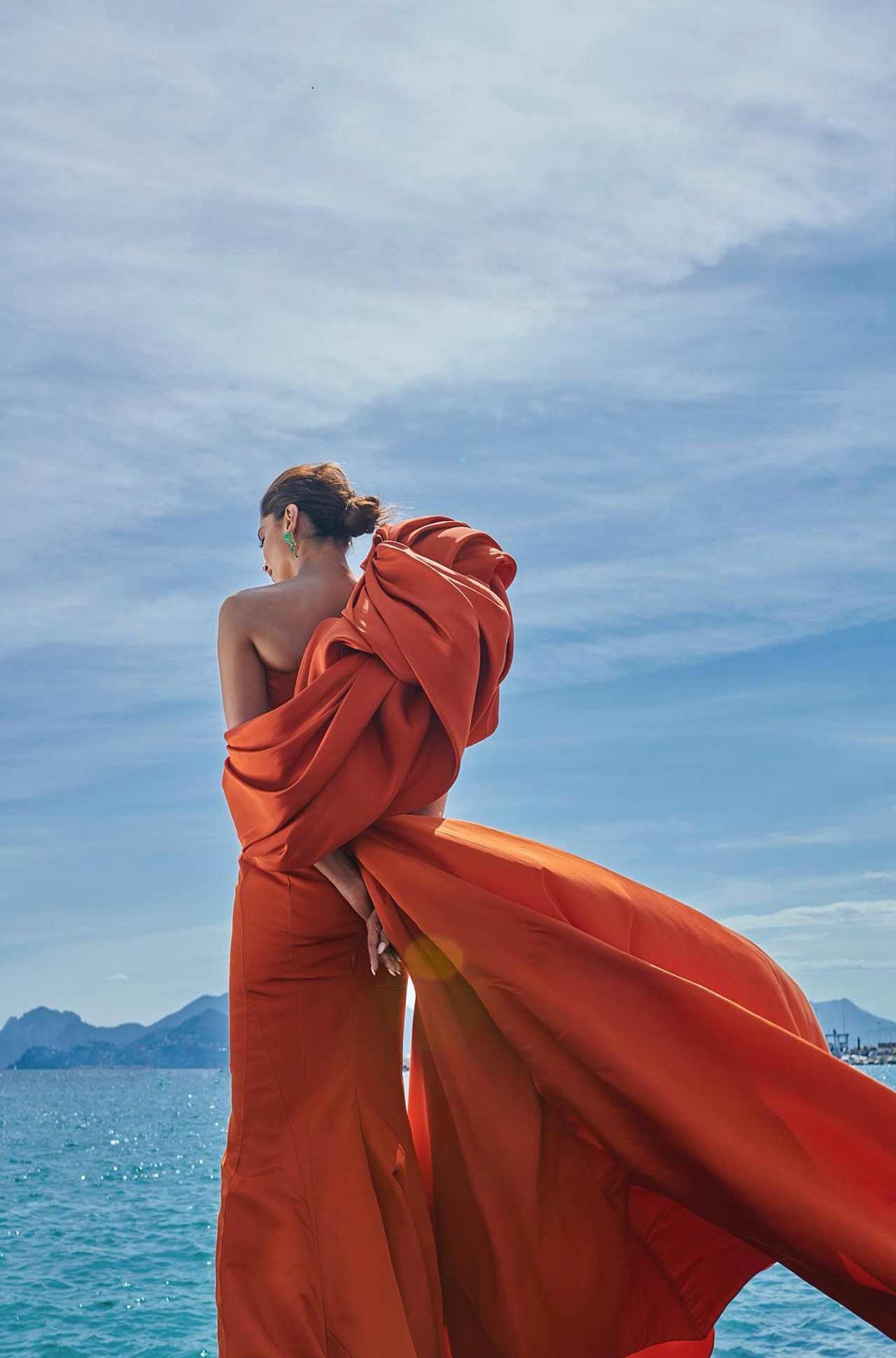 Deepika Padukone took to her Instagram handle and shared several pictures. She left netizens in awe of her yet again as she opted for a stunning orange gown dress.