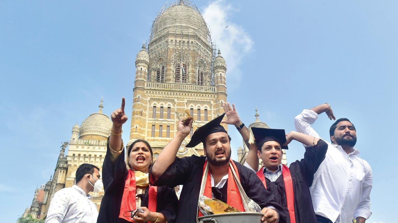 On the occasion of National Unemployment Day, outside CSMT, September 2021. Youth Congress workers along with MLA Zeeshan Baba Siddique, President, Mumbai Youth Congress, protested by selling peanuts while wearing graduation gowns to highlight the plight of educated youth who they claimed are forced into menial jobs due to rising unemployment. Pic/Getty Images