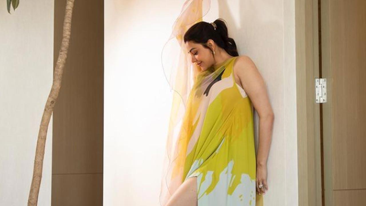 New mommy in town Kajal Aggarwal exudes summer vibes in yellow slit dress