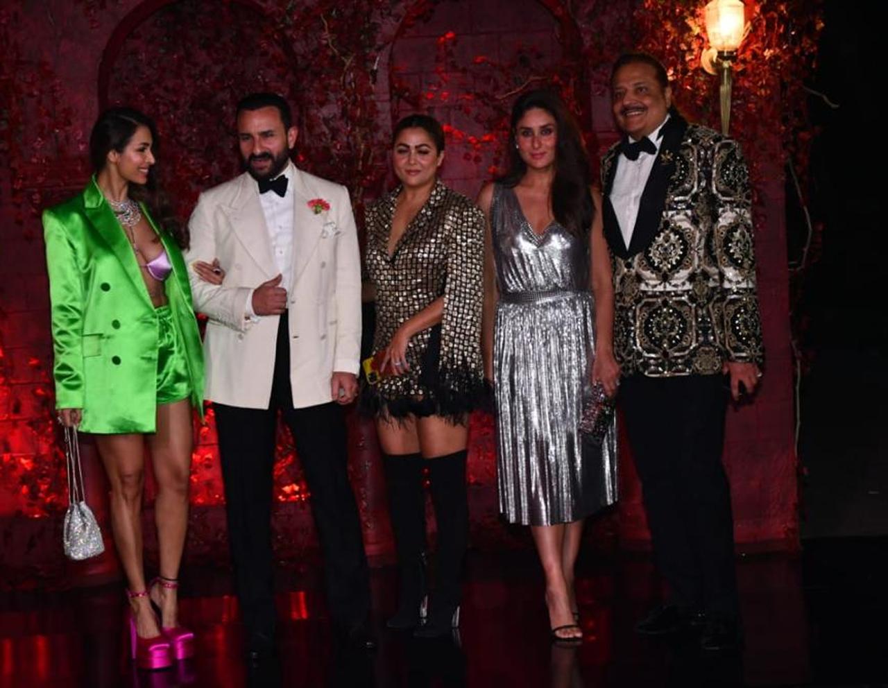 Family comes first! Half of Bollywood’s glamour and glitz lie in this picture alone. Malaika Arora shines in a green and pink dress, Saif Ali Khan looks dapper in a white suit, and Kareena Kapoor Khan oozes oomph in a silver dress that makes her look perfect to the T.