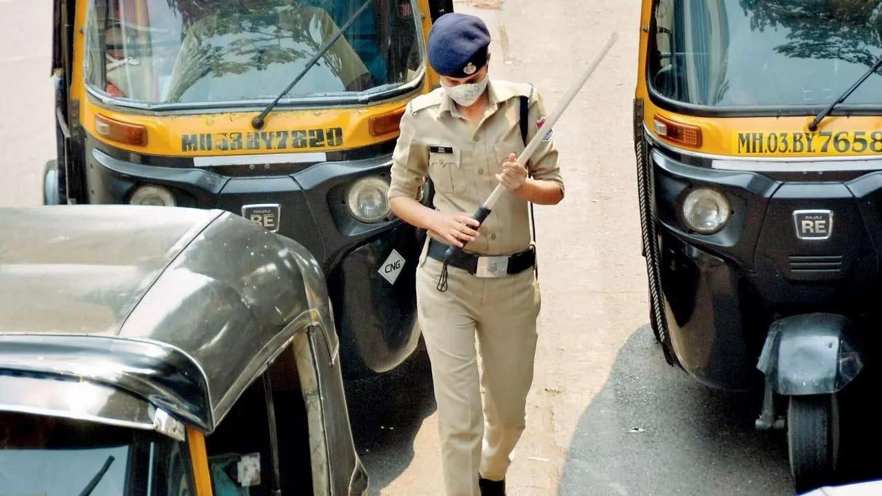 Stick up, Swagger on: A woman police constable goes about her day in Ghatkopar East. Pic/Sayyed Sameer Abedi