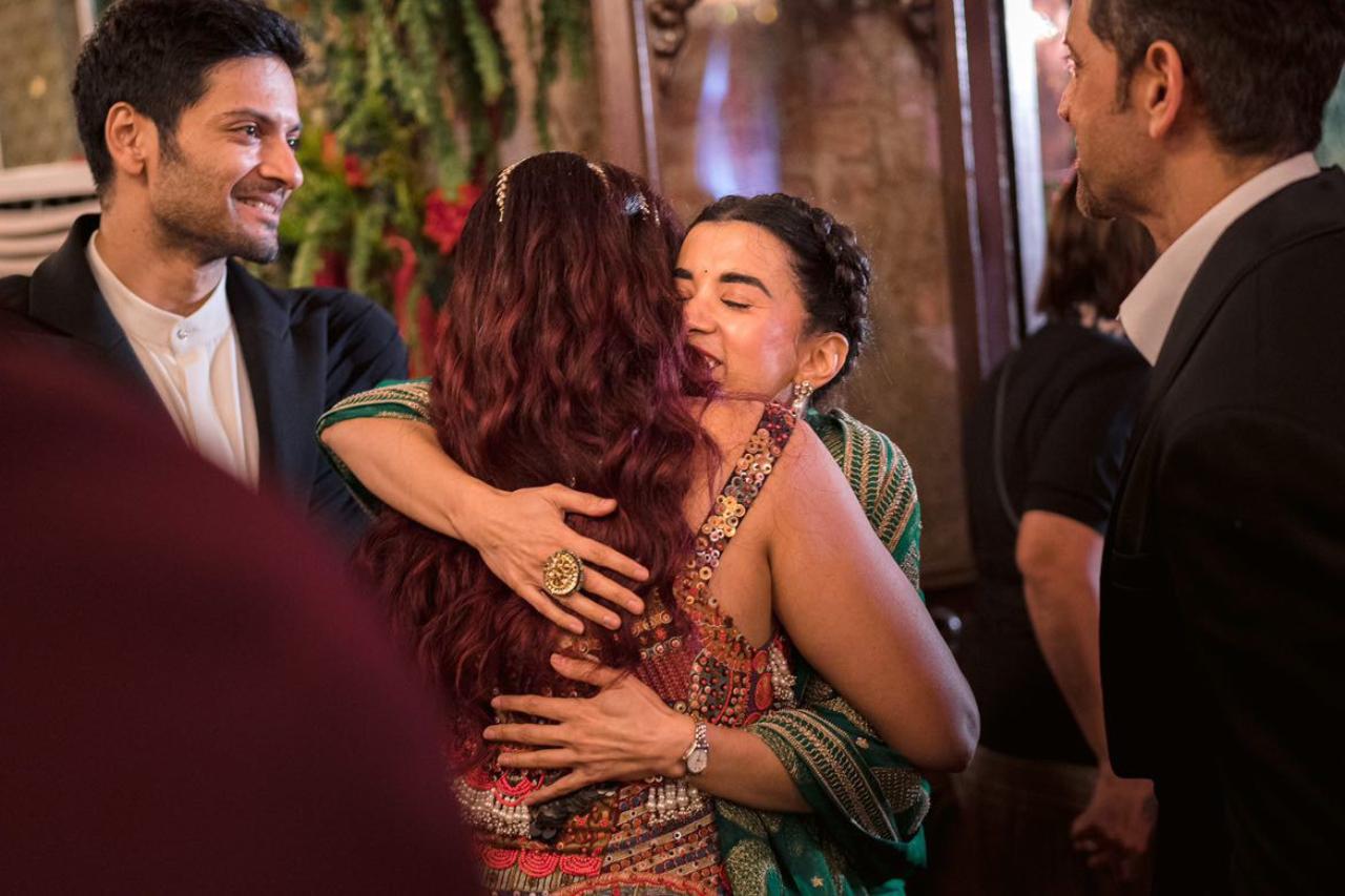 The girls break into a hug as Hrithik Roshan and Ali Fazal look on