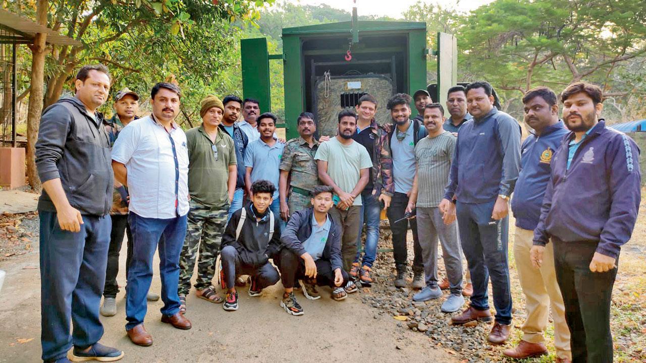 Leopard rescue team members from Thane and SGNP, forest department staff and volunteers strike a pose after capturing C57 at Aarey Milk Colony