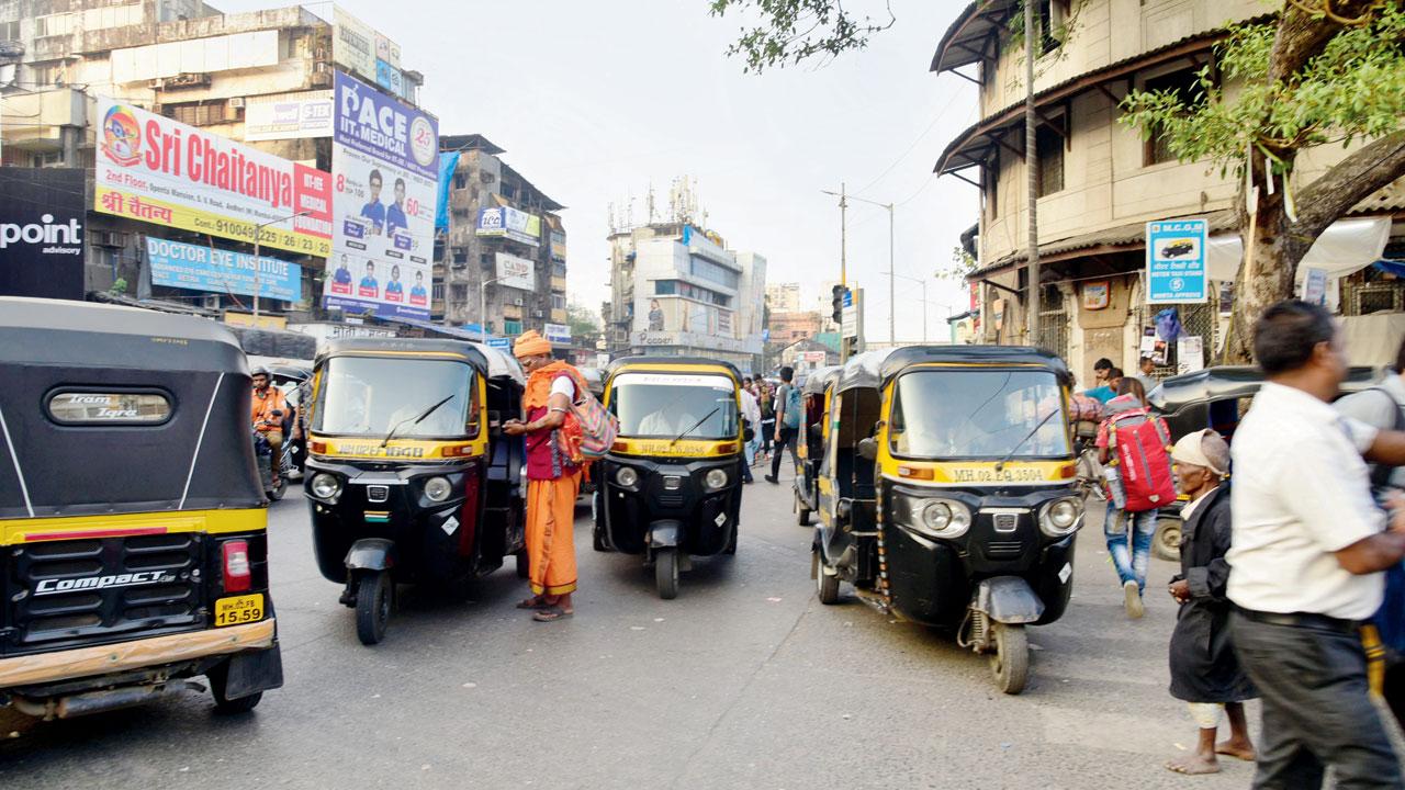 Parked auto rickshaws take up around two lanes on SV Road, Andheri West. Pic/Atul Kamble